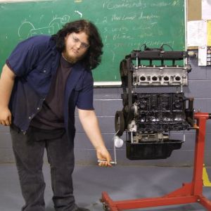 Dakota Hutchinson cranks his engine training aid.