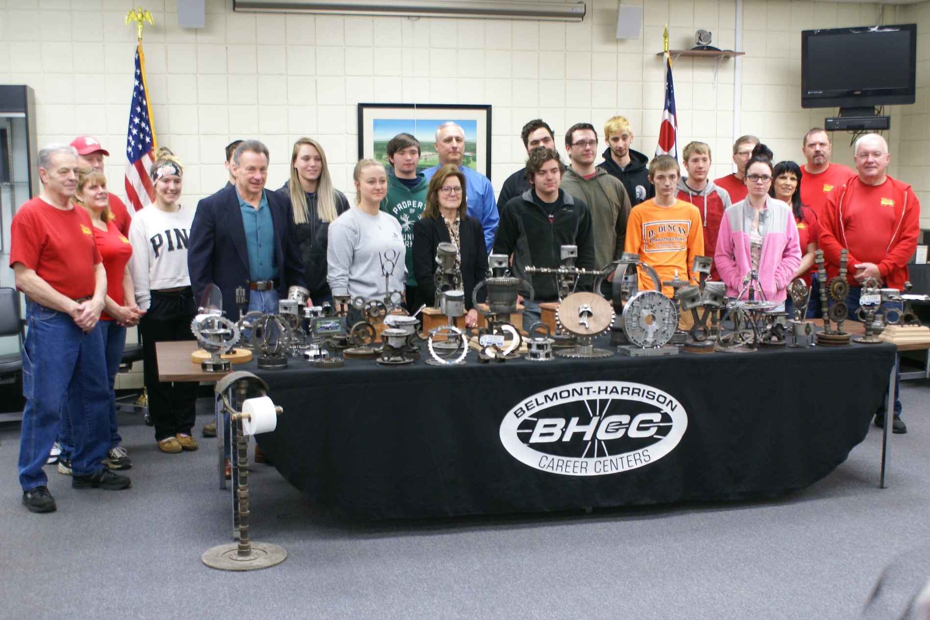 Judge Fregiato and Car Club Admire Trophies Made by Career Center Students