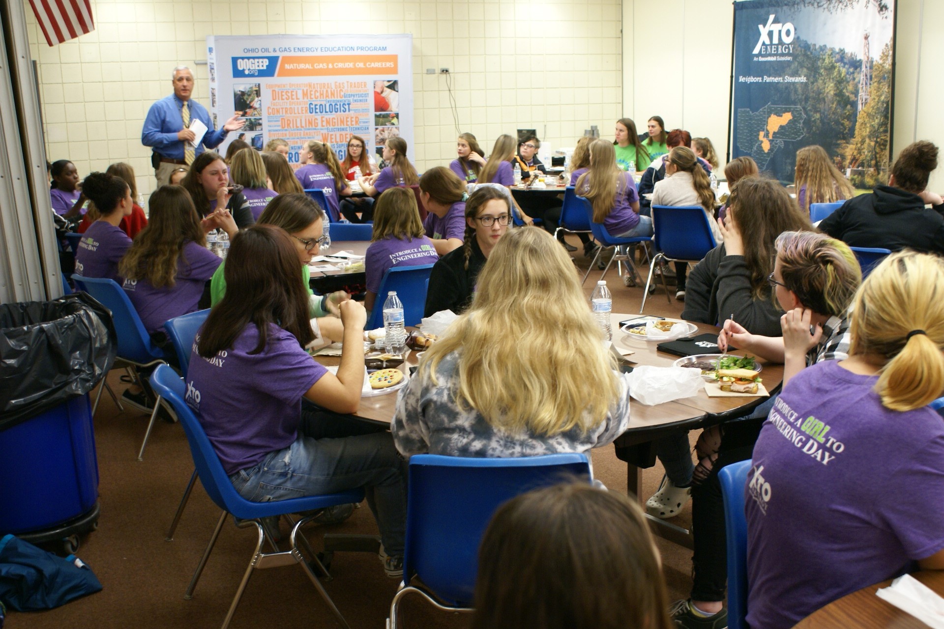 Superintendent Richard Schoene addresses students at XTO Energy event